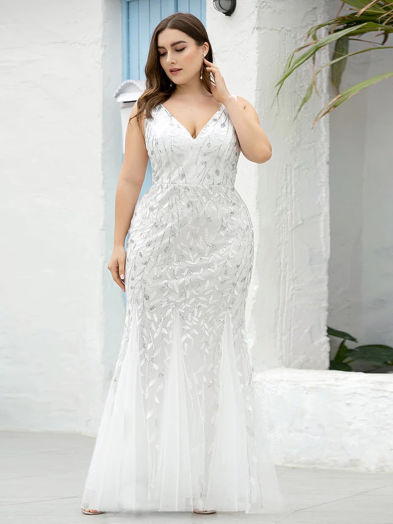 White plus sized wedding dress with fishtail and sequins.